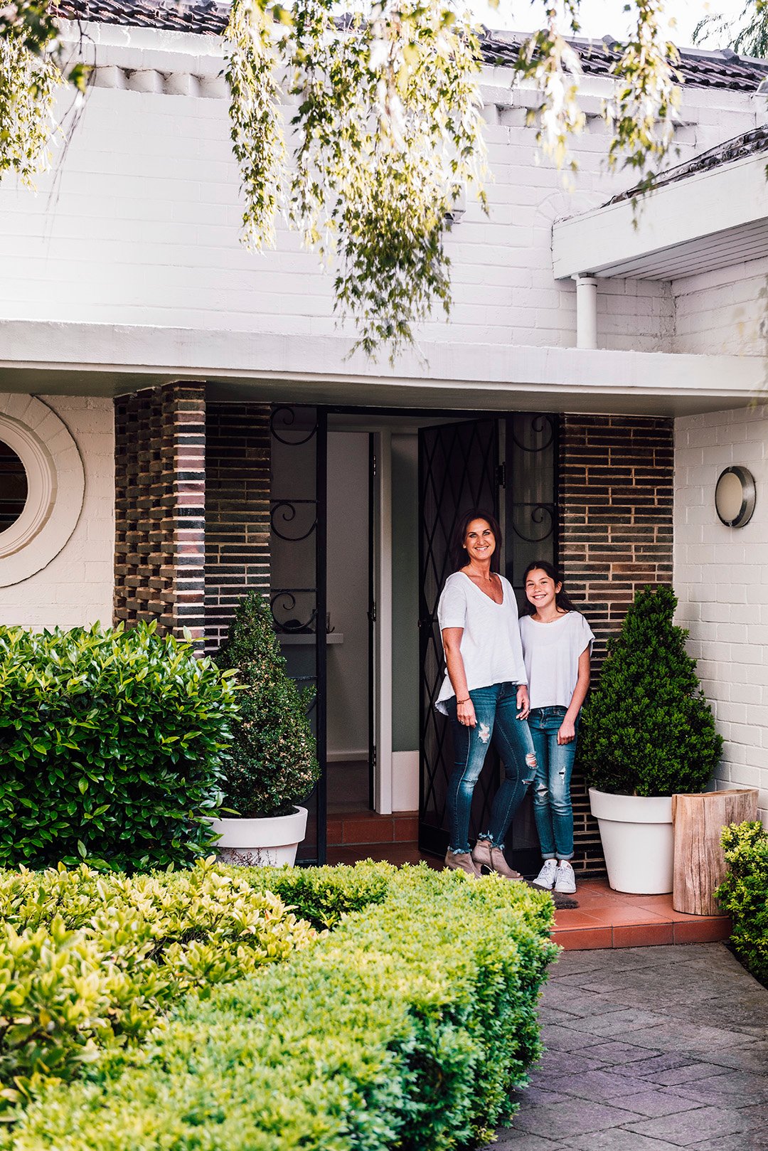 Bec Shnider and daughter Berry outside their Melbourne home.