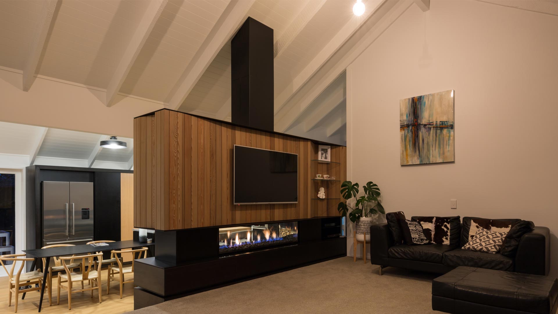 Double sided fireplace with timber framing