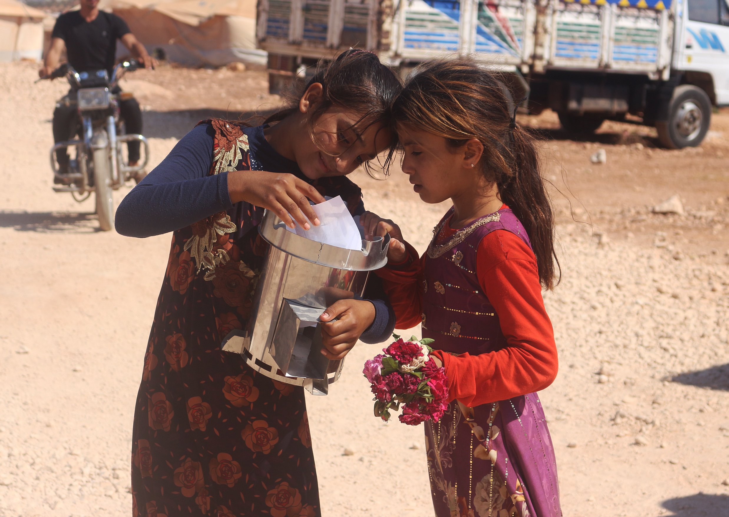 Two girls with thier fire for life stoves